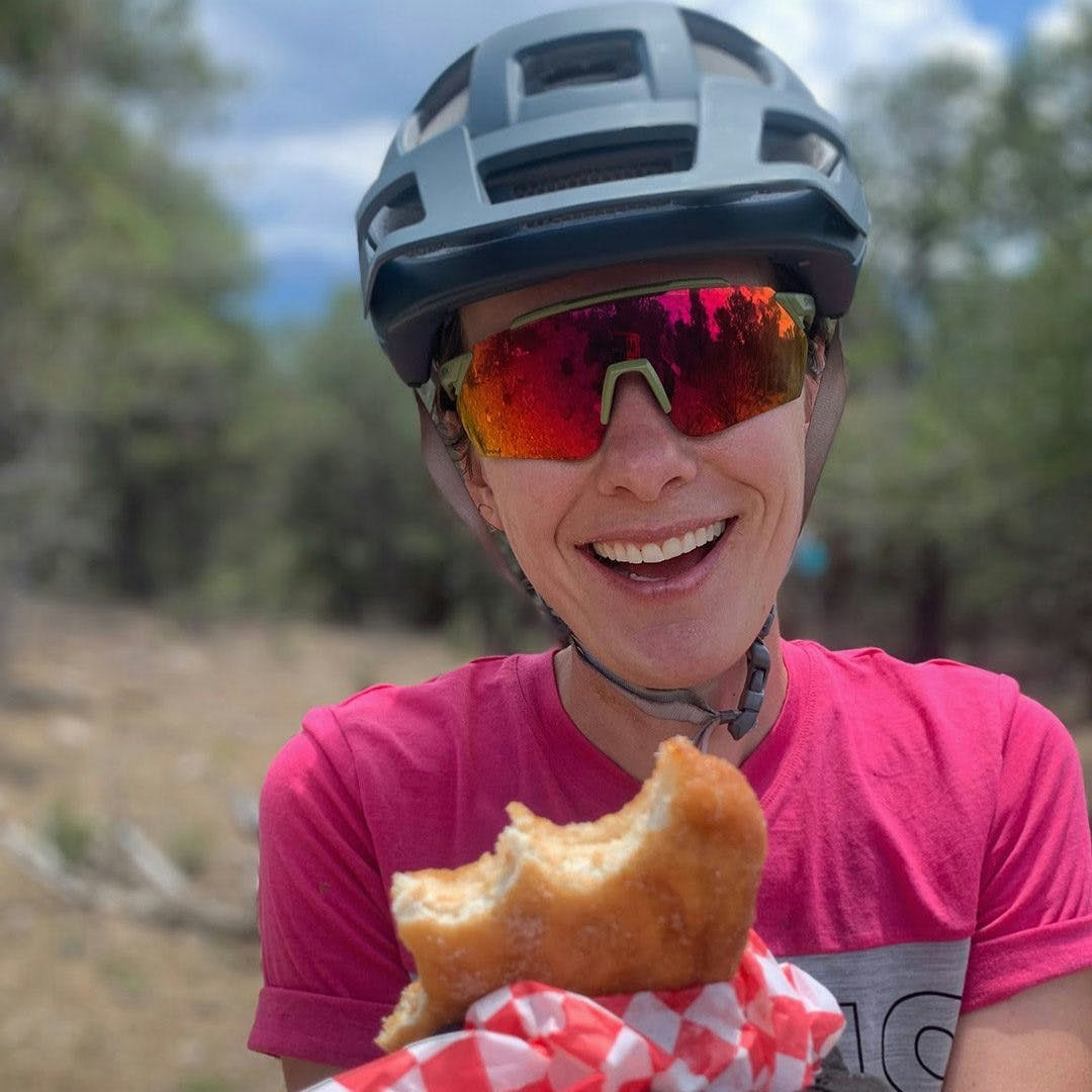 Uri Carlson holding a mid-ride snack