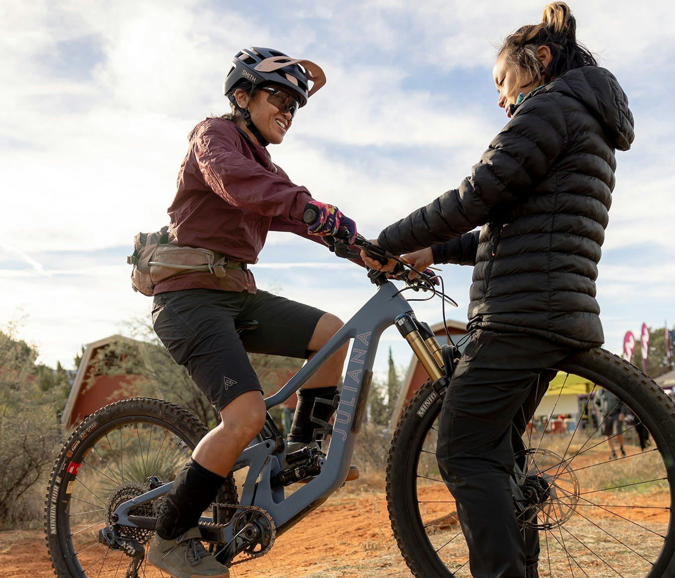 Juliana/SRAM XC Athlete Evelyn Dong setting up the controls on a Juliana Bicycles Roubion for a female mountain biker 