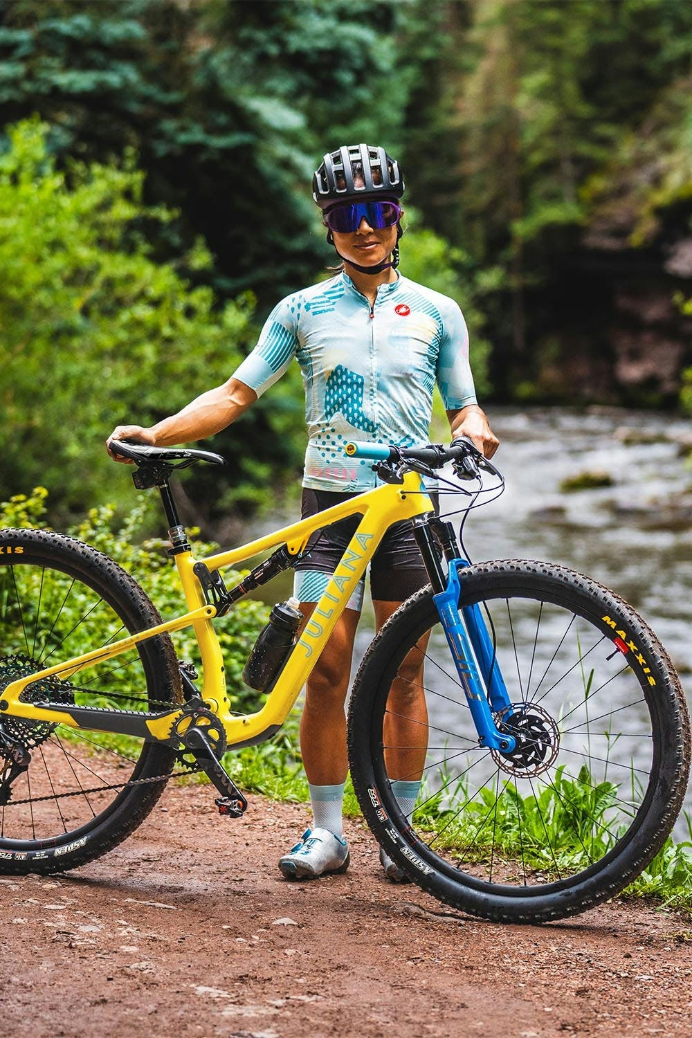 Juliana Bicycles Pro XC Rider - Evelyn Dong standing with her Wilder X01 AXS RSV Full Suspension Mountain bike