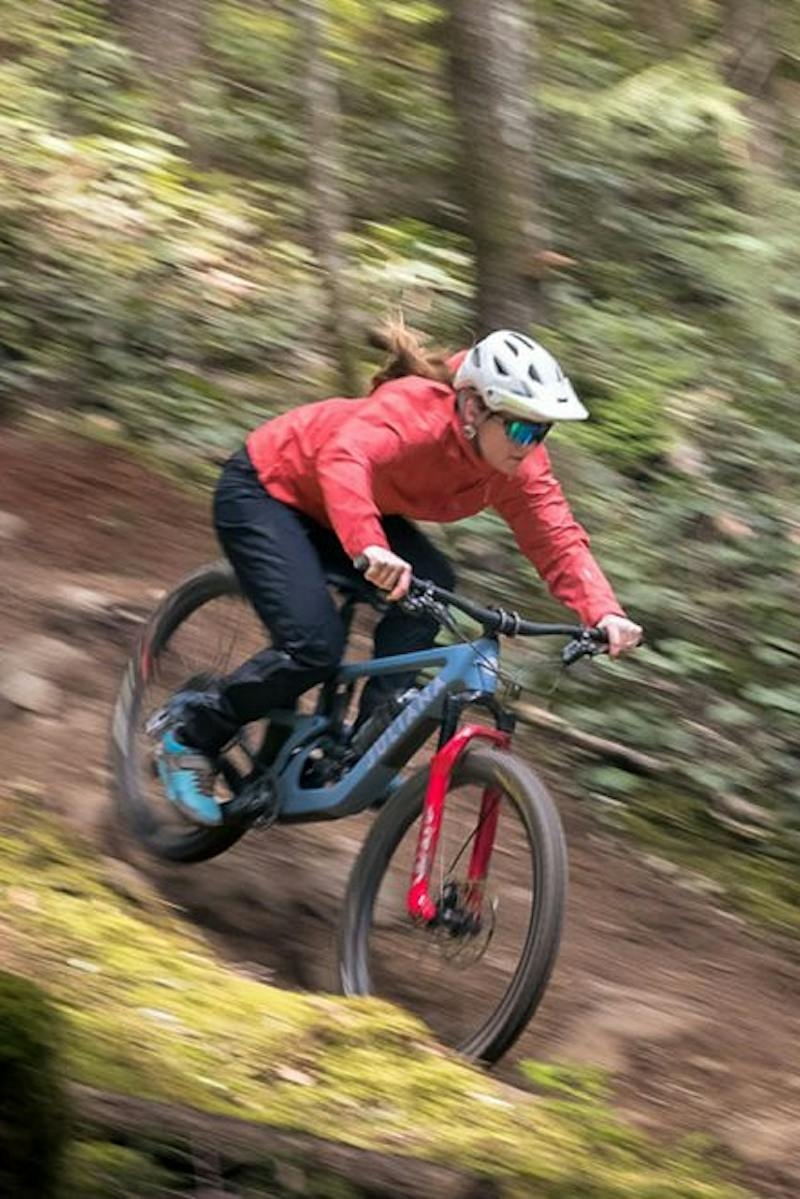 Britt Phelan riding the Roubion trail bike in the woods